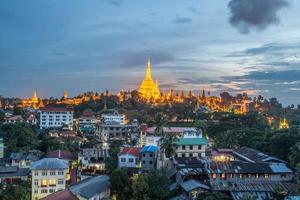Beautiful view of Shwedagon pagoda the most tourist attraction in Yangon township of Myanmar at night. photo