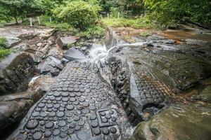 Kbal Spean waterfall the mystery place of ancient Khmer empire in Siem Reap, Cambodia. photo