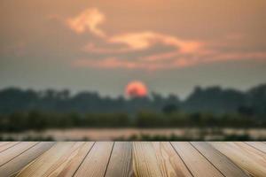 The Wood floor with blurred sunset background. photo