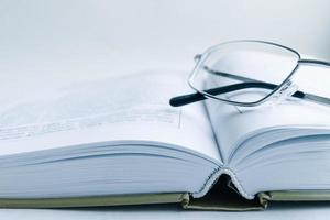 a large book is open on the table photo