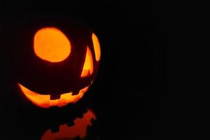 Jack O' Lantern lit in the dark for Halloween photo