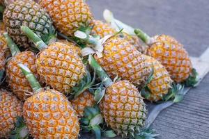 Pile of pineapples for sale in the market photo