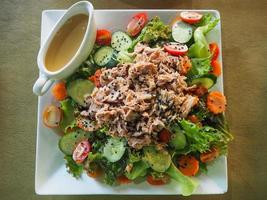 Close-up of tuna salad on white plate photo