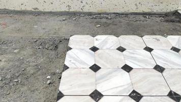 The process of laying tiles in a building. photo