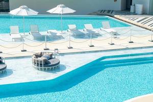 umbrella with bed pool around swimming pool photo