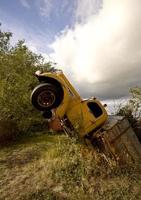 Antique truck sticking out of ground in Saskatchewan Canada photo