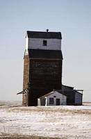 Old wooden grain elevator in winter photo