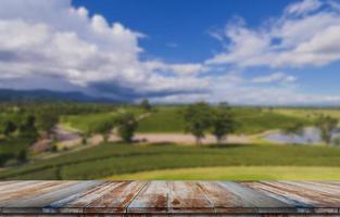 Empty wooden floor with blurred tea plantations Can be used for product display editing photo