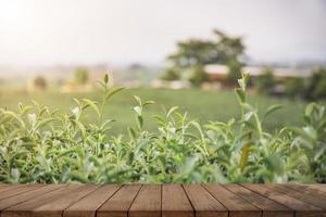 Empty wooden floor with blurred tea plantations Can be used for product display editing photo