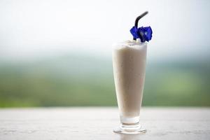 Vanilla Milkshake Smoothie in a Coffee Shop nature blur background photo