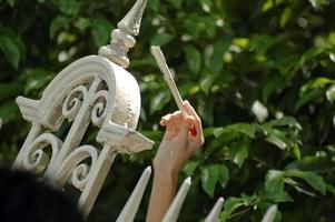painting old traditional fence in bangkok Thailand photo