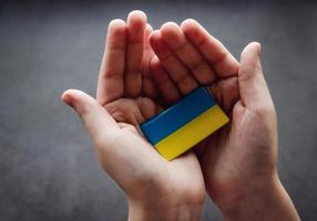 Ukraine flag in hands photo