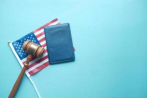 a gavel and passport on a american flag photo