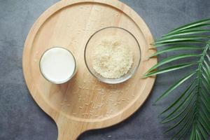 glass of milk and rice on a table, non dairy milk concept photo