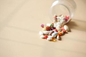 Close up of many colorful pills and capsules photo