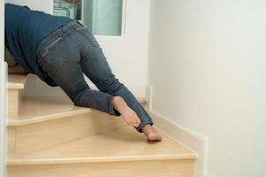 Asian lady woman patient fall down the stairs because slippery surfaces photo