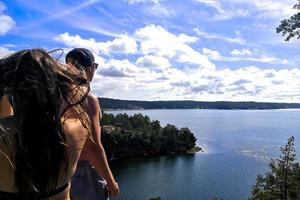 Couple looking to the sea from heights photo