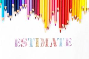 Multi-colored wooden sticks Wooden colouring pencils and Estimate on white background photo