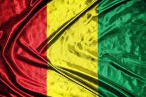 guinea cloth flag Satin Flag Waving Fabric Texture of the Flag photo