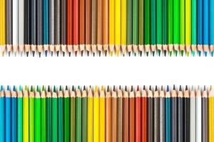 Multi-colored wooden sticks Wooden colouring pencils on white background photo