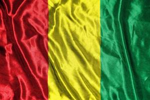 guinea cloth flag Satin Flag Waving Fabric Texture of the Flag photo