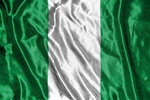 bandera de tela de nigeria bandera de satén ondeando la textura de la tela de la bandera foto
