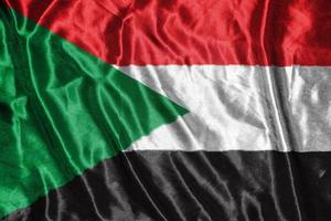 sudan cloth flag Satin Flag Waving Fabric Texture of the Flag photo