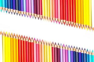 Multi-colored wooden sticks Wooden colouring pencils on white background photo