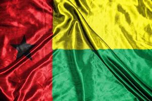 guinea bissau cloth flag Satin Flag Waving Fabric Texture of the Flag photo