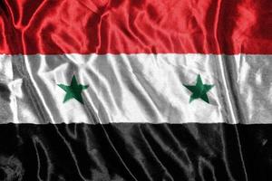 syria cloth flag Satin Flag Waving Fabric Texture of the Flag photo