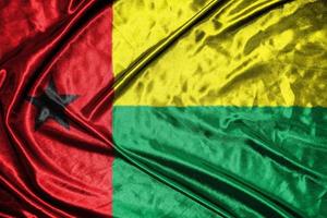 guinea bissau cloth flag Satin Flag Waving Fabric Texture of the Flag photo