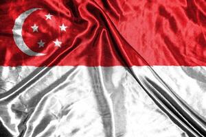 singapore cloth flag Satin Flag Waving Fabric Texture of the Flag photo