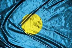 palau cloth flag Satin Flag Waving Fabric Texture of the Flag photo