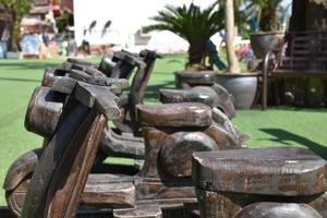 Wooden benches in motorbike shape for traveller at the temple, thailand. photo