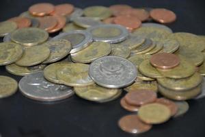 Thai bahts coins on dark background, photo