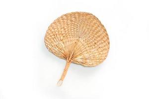 rattan hand fan with white background photo
