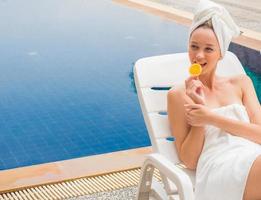 beautiful girl relaxing pool side  beauty concept photo