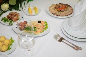 served table with crockery and food photo