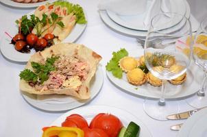 served table with crockery and food photo