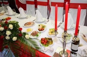 served table with crockery and food photo