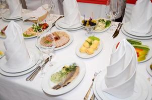 served table with crockery and food photo