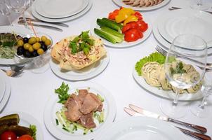 served table with crockery and food photo