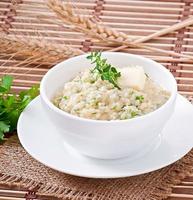 Wheat porridge with herbs photo