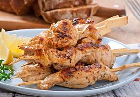 grilled chicken on bamboo skewers photo