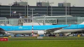 Side view, KLM airplane at taxiway video