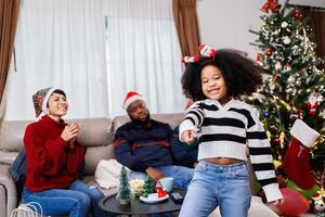 African American girl dancing and enjoying with her family. African American family photo