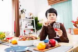 Portrait of a confident woman celebrating Christmas day alone at home. photo