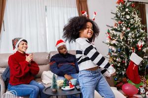 African American girl dancing and enjoying with her family. African American family photo