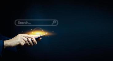 man hand using smartphone to use search engine optimization SEO tools for finding customer photo