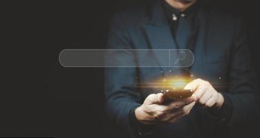 man hand using smartphone to use search engine optimization SEO tools for finding customer photo
